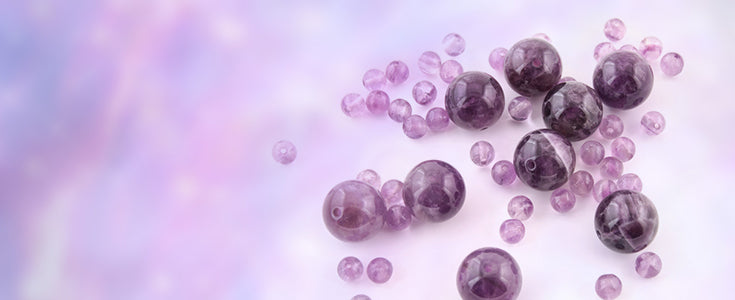 Amethyst cluster on white background, showcasing its purple hues and crystal formations.