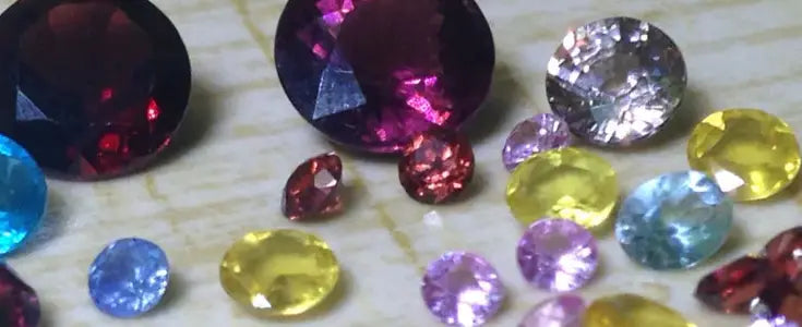 Woman's hands gently cleansing a delicate gemstone necklace with a soft cloth.