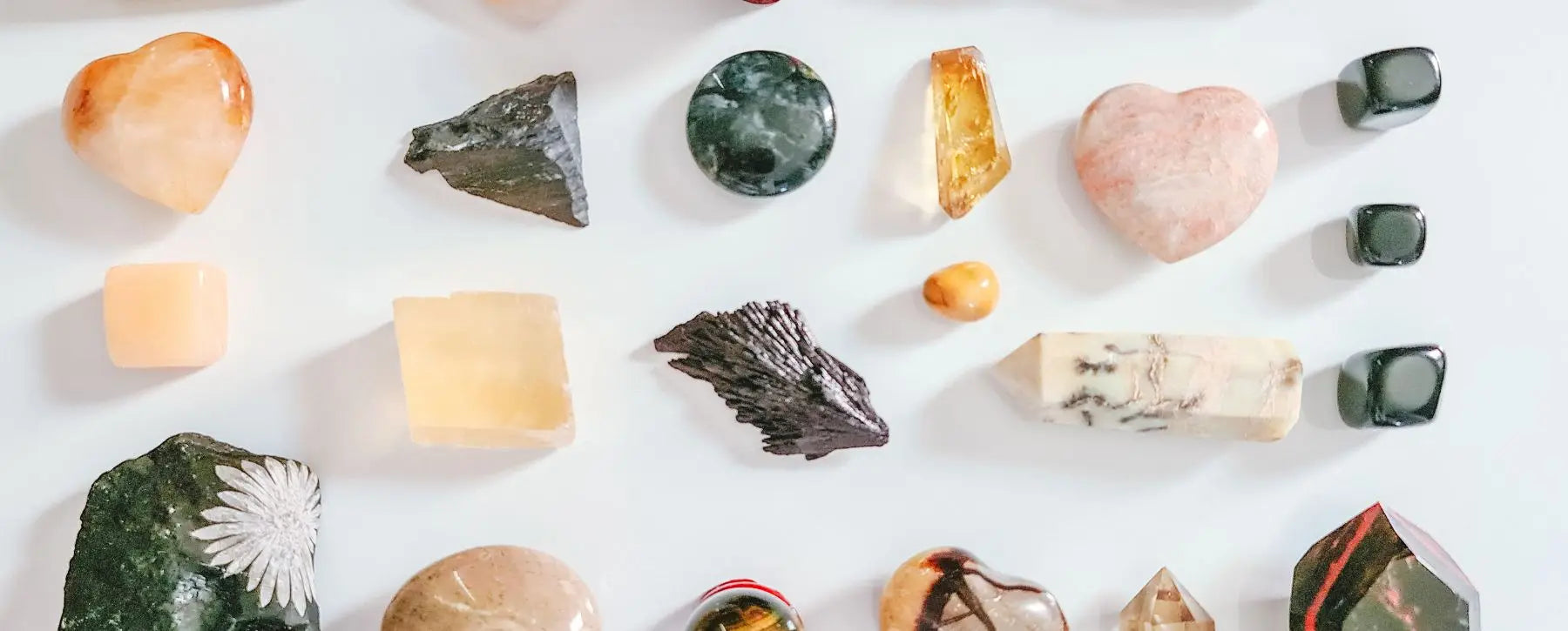 Scorpio power crystals: amethyst, black tourmaline, smoky quartz, and bloodstone, enhancing energy and intuition.