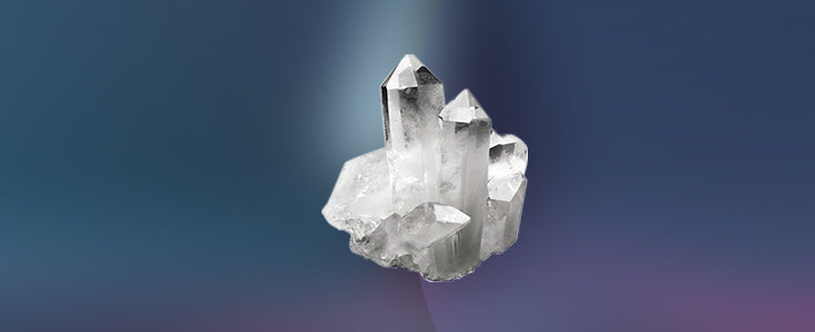 Close-up of raw quartz crystals on a rock surface, showcasing various formations and colors.