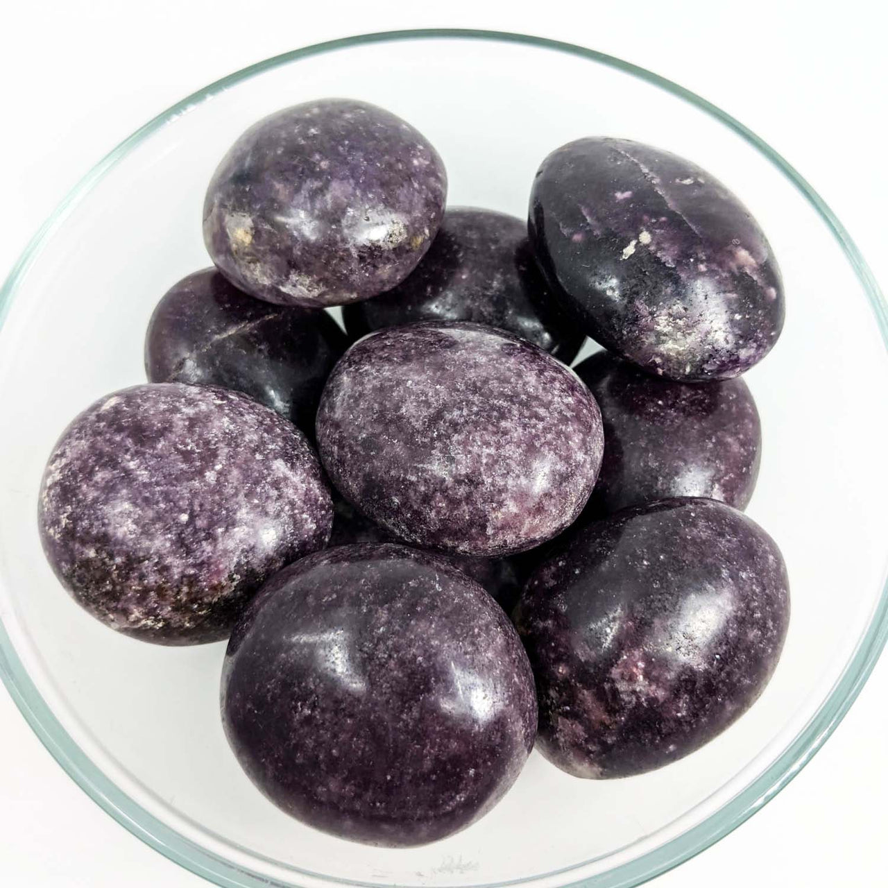 Bowl of black olives featuring 1 Lepidolite Dark Pebble 80g #SK9021 for referral history