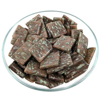 Chocolate squares with mint flecks in glass dish for referral history rewards