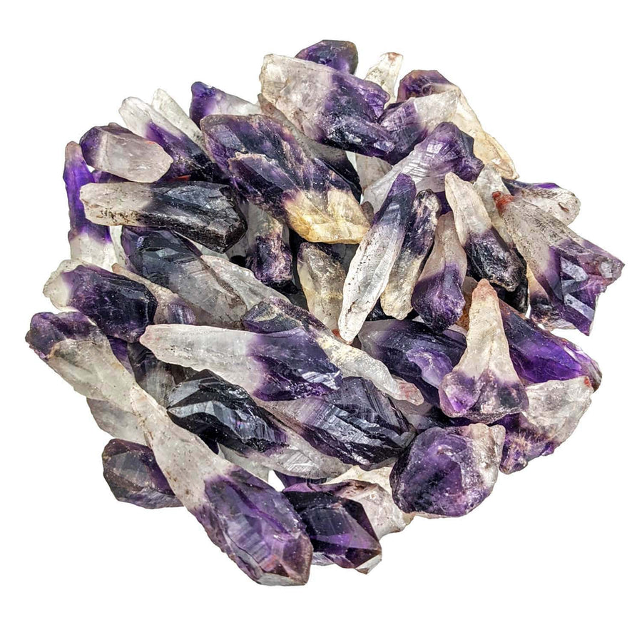 Amethyst Cacoxenite crystals in a glass bowl showcasing mixed size rough points