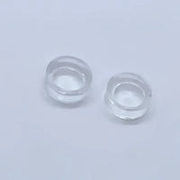 Two clear contact lenses displayed on an Acrylic & Metal Deep Easel Stand #Q152