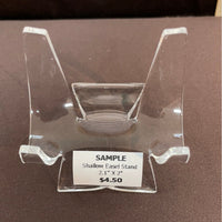Clear plastic easel stand with a price tag of $4.50 for Acrylic & Metal Stands Q152