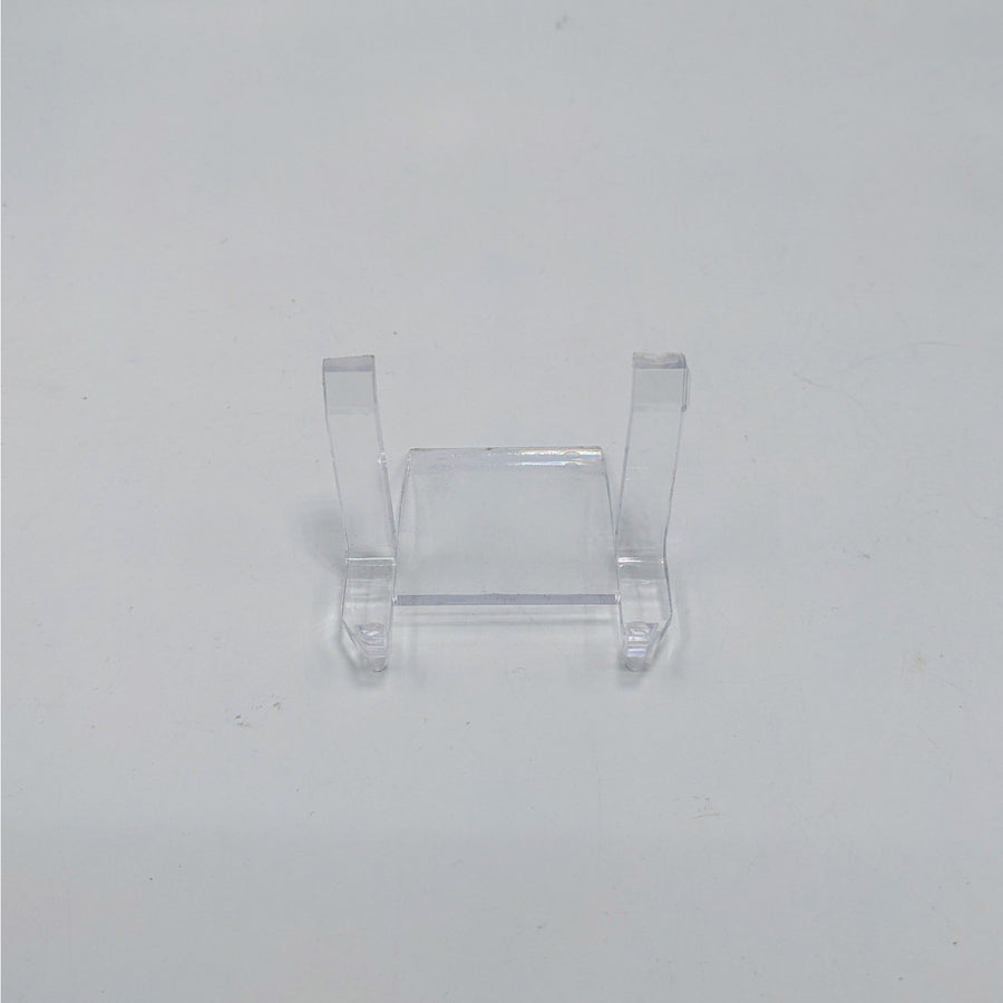 Clear plastic display stand with two supports for showcasing ring holder or art