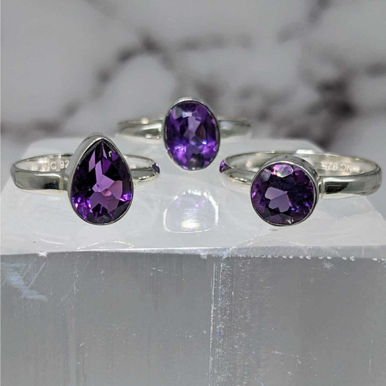 Elegant Amethyst S.S. Faceted Ring #LV3880 on white marble display