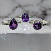 Elegant Amethyst S.S. Faceted Ring #LV3880 on white marble display