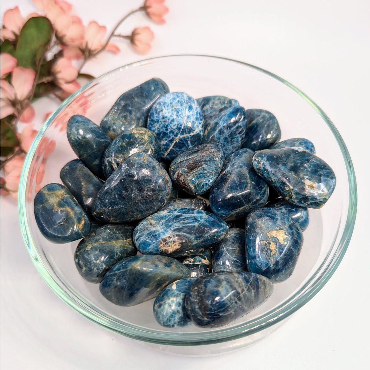 Polished blue apatite tumbled stones in a bowl, size 1.2 to 1.7 inches