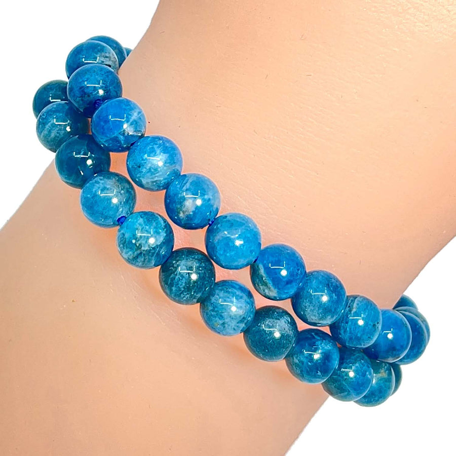Apatite 7mm Round Bead Bracelet features bright blue glass beads in a double-stranded design