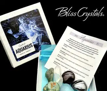 Aquarius zodiac card displayed alongside healing crystals and an information sheet.