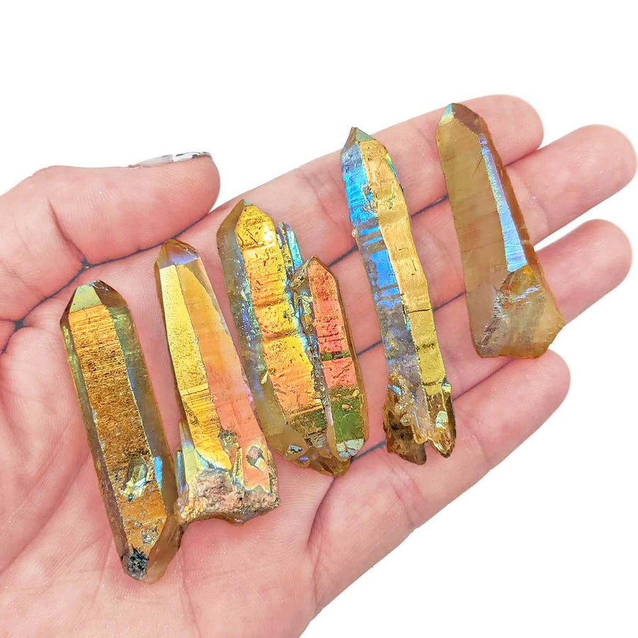 Metallic gold Aura Quartz Rough Point #SK7797 with iridescent blue patches in hand