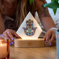 Aura Spa Selenite Mood Lamp with white triangular hamsa on wooden base