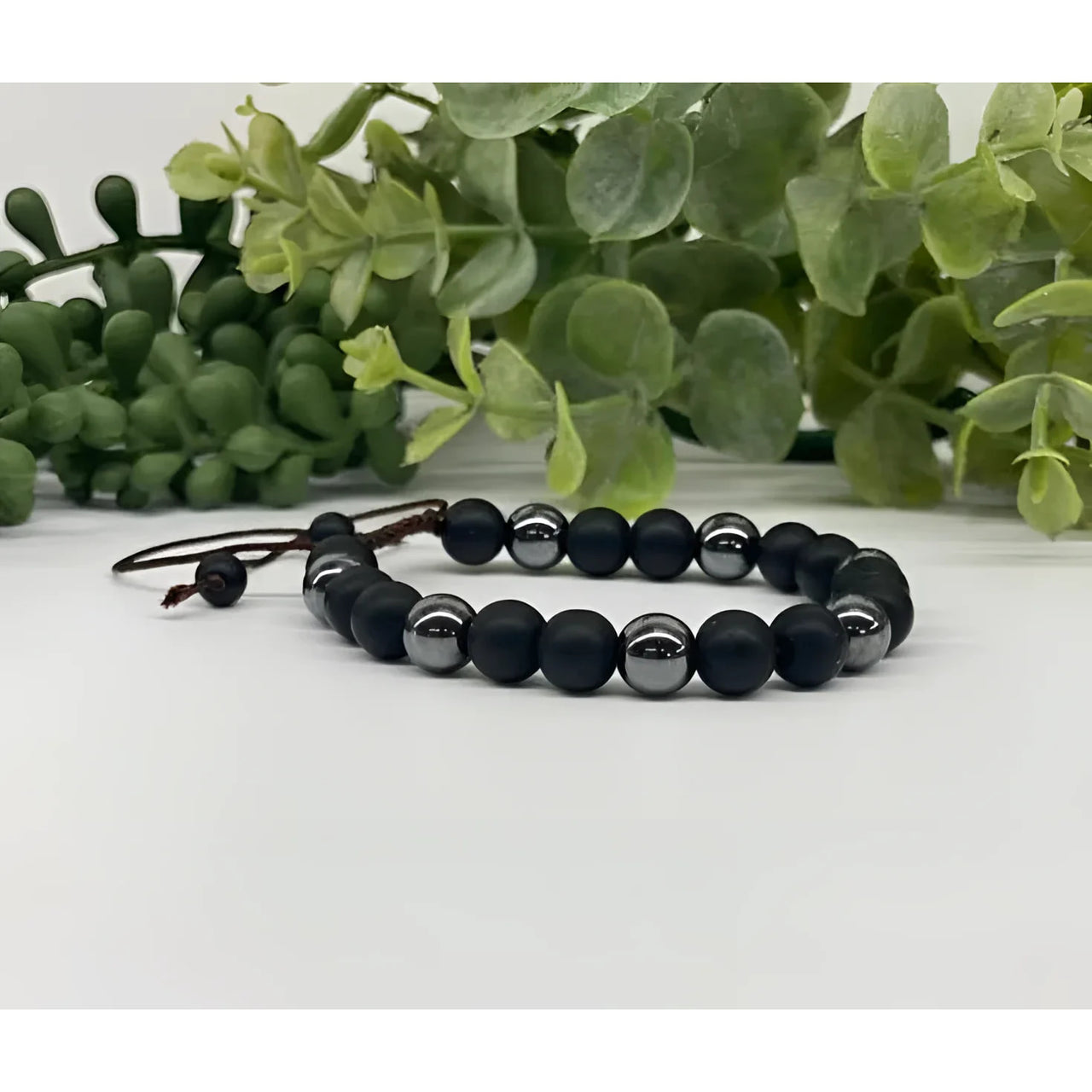 Black and silver beaded bracelet featuring Black Obsidian and Hematite for adjustable wear