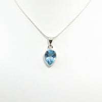 Blue Topaz teardrop pendant necklace in sterling silver jewelry display