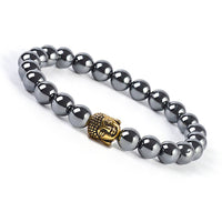 Gray beaded bracelet with a golden Buddha head and hematite beads for spiritual style