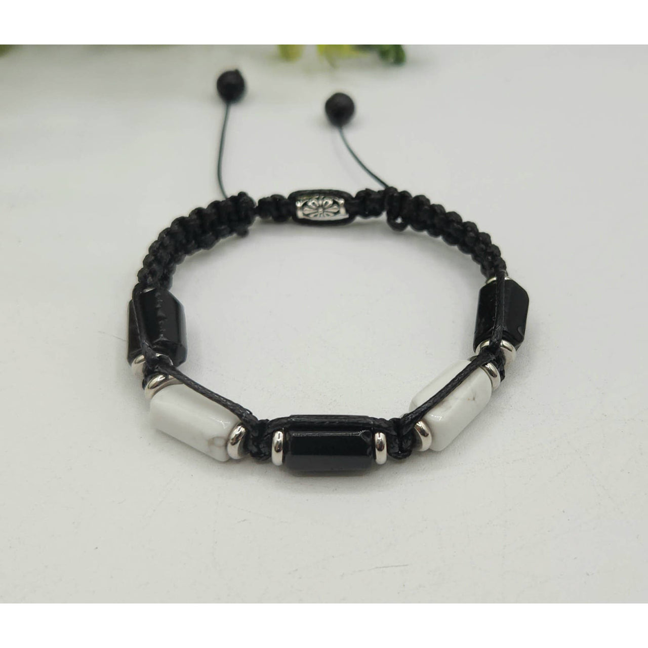 Black and white beaded bracelet featuring Black Tourmaline and White Howlite gemstones
