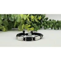 Braided black bracelet with white and black rectangular beads for CALM PROTECTION jewelry