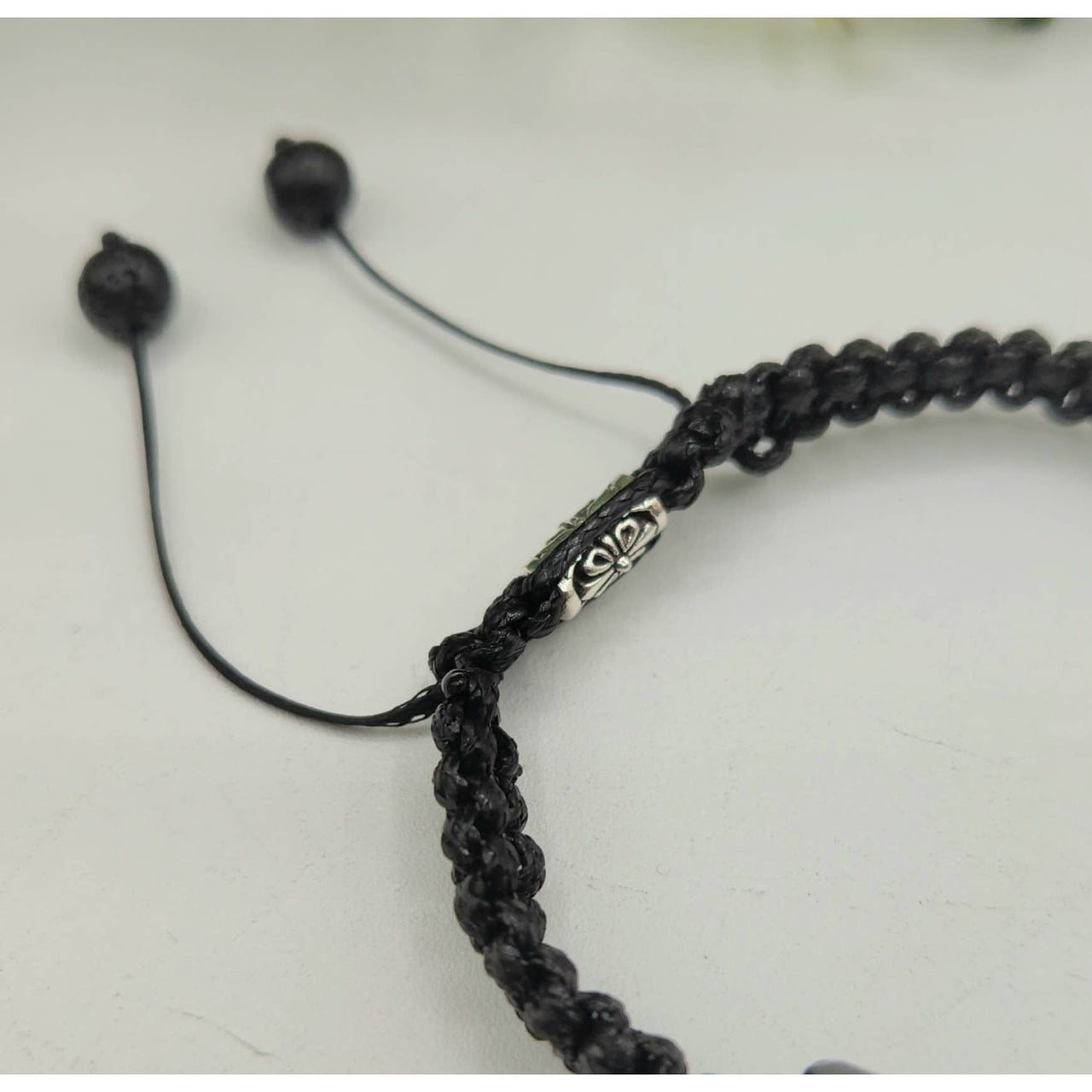 Black braided bracelet with silver accents from CALM/PROTECTION Black Tourmaline and White Howlite bracelet