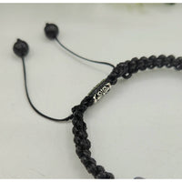Black braided bracelet with silver accents from CALM/PROTECTION Black Tourmaline and White Howlite bracelet