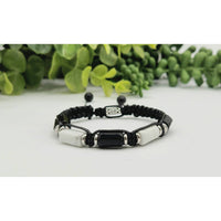 Black and white beaded bracelet featuring Black Tourmaline and White Howlite for protection