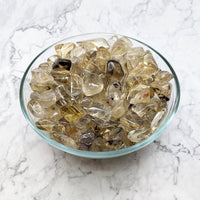A bowl of yellow quartz in a ’Citrine Natural Tumble Stones’ product from Bliss Crystals