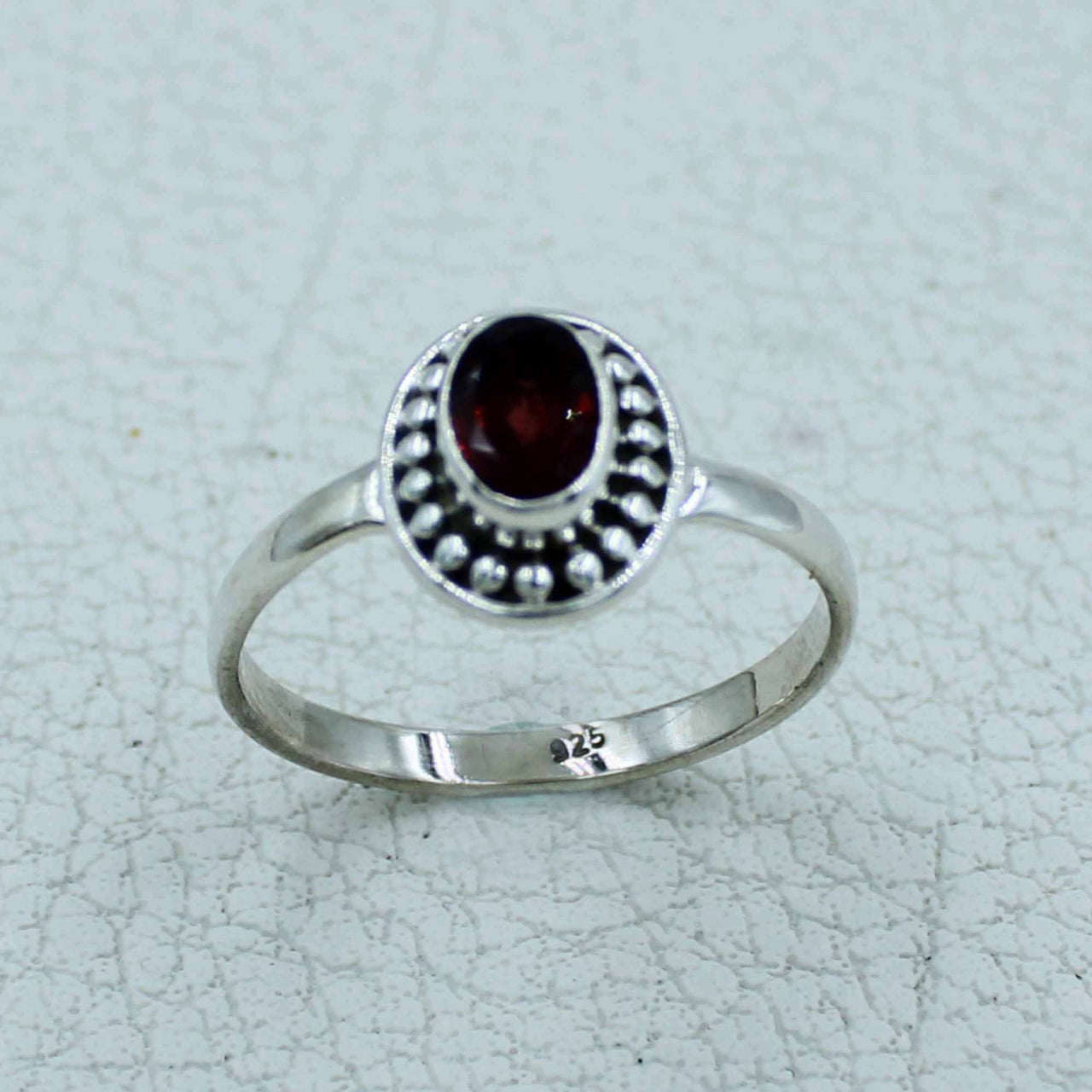 Oval faceted citrine or peridot sterling silver ring with bezel-set stone and beaded detailing