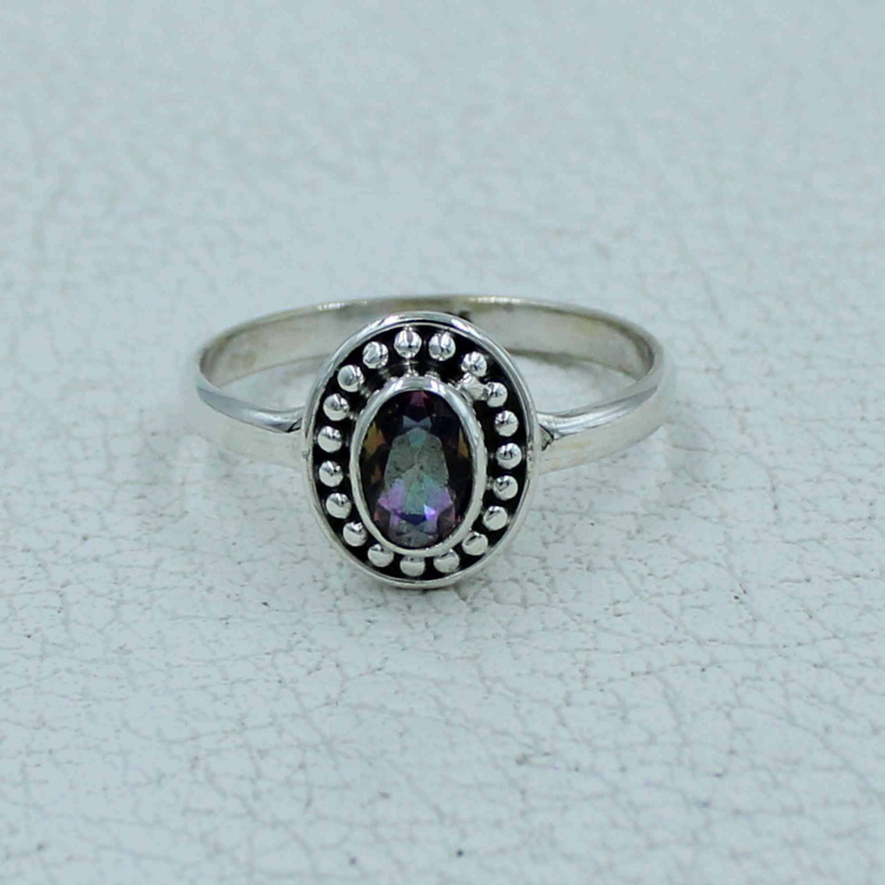 Oval faceted citrine or peridot sterling silver ring with iridescent gem and beaded border