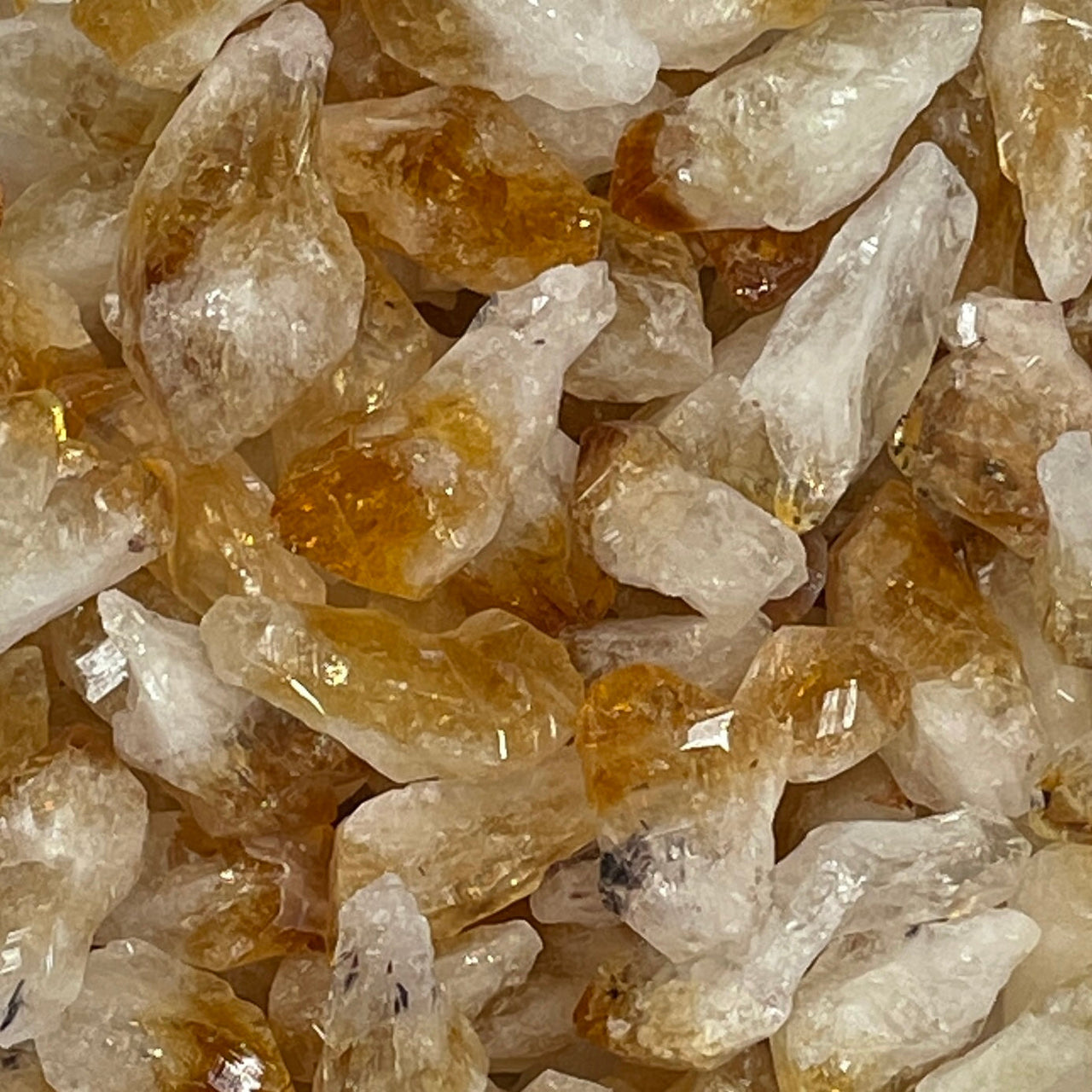 Pile of citrine rough points showcasing natural raw citrine quartz crystals and citrine quartz points