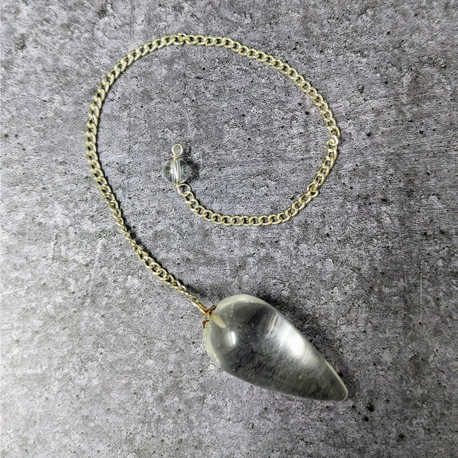 Clear Quartz Necklace: Close-up of Heart Pendant and Chain - Polished Teardrop Pendulum