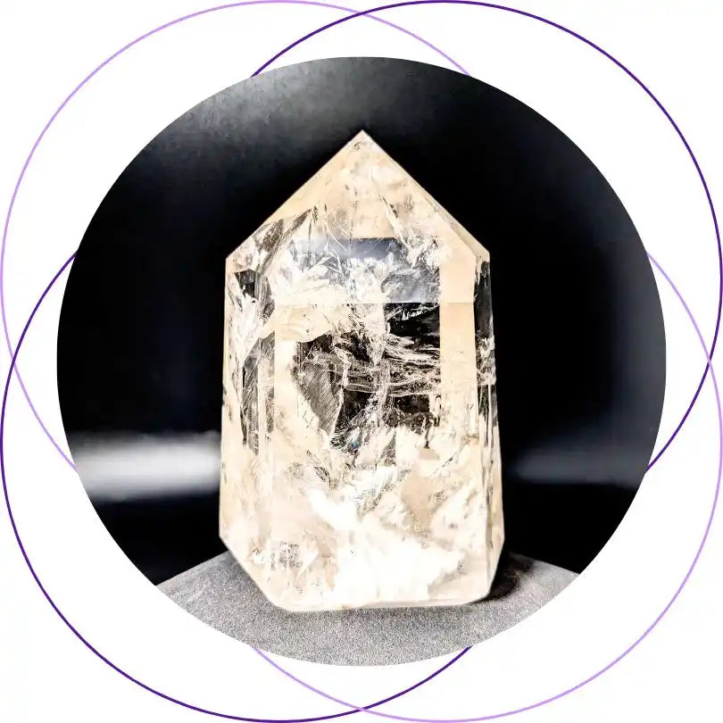 Clear quartz crystal point with natural striations and inclusions.