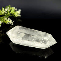 Clear quartz dt 5.25 inch natural point translucent crystal with faceted elongated shape and internal inclusions