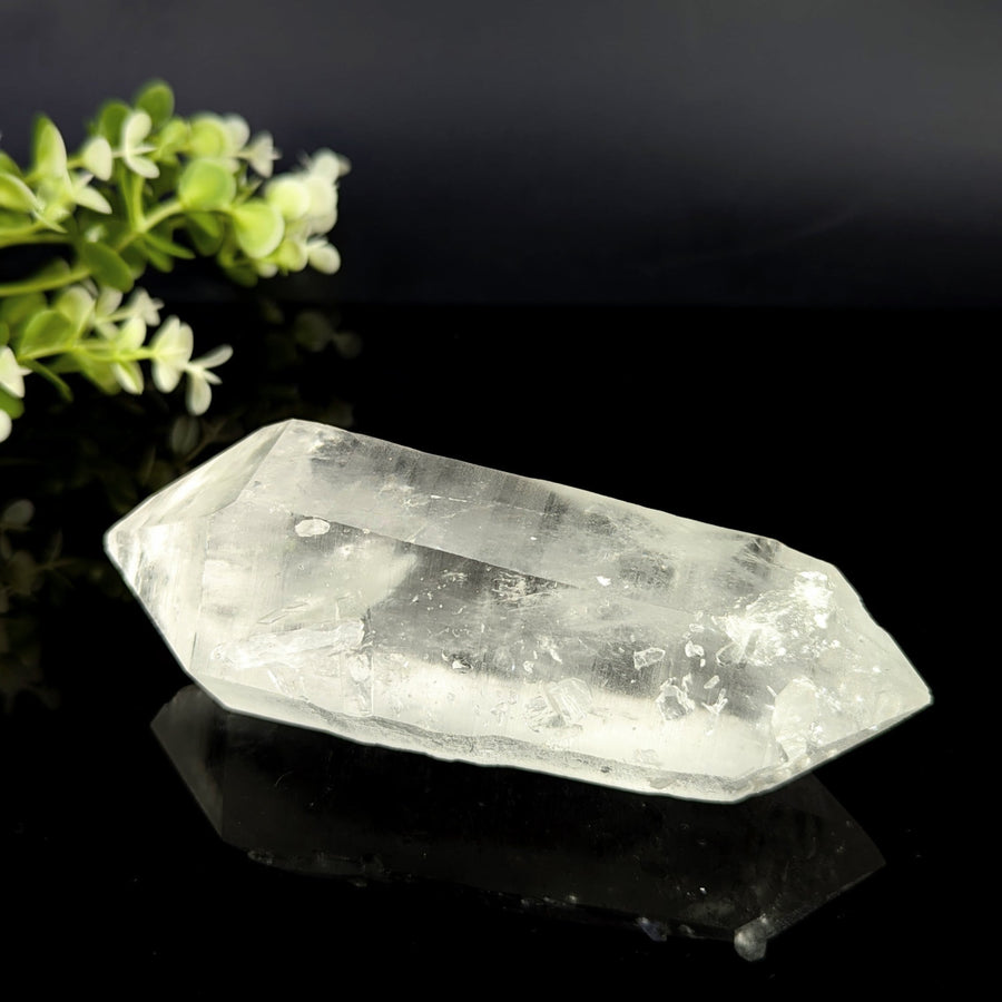 Clear quartz dt 5.25 inch natural point translucent crystal with faceted elongated shape and internal inclusions