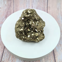 COCADA Pyrite 3.4’ Rough Cube Specimen #SK9903 on a white plate