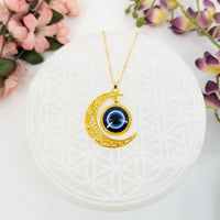 Gold crescent moon necklace with evil eye pendant, 20-inch chain, luxurious jewelry
