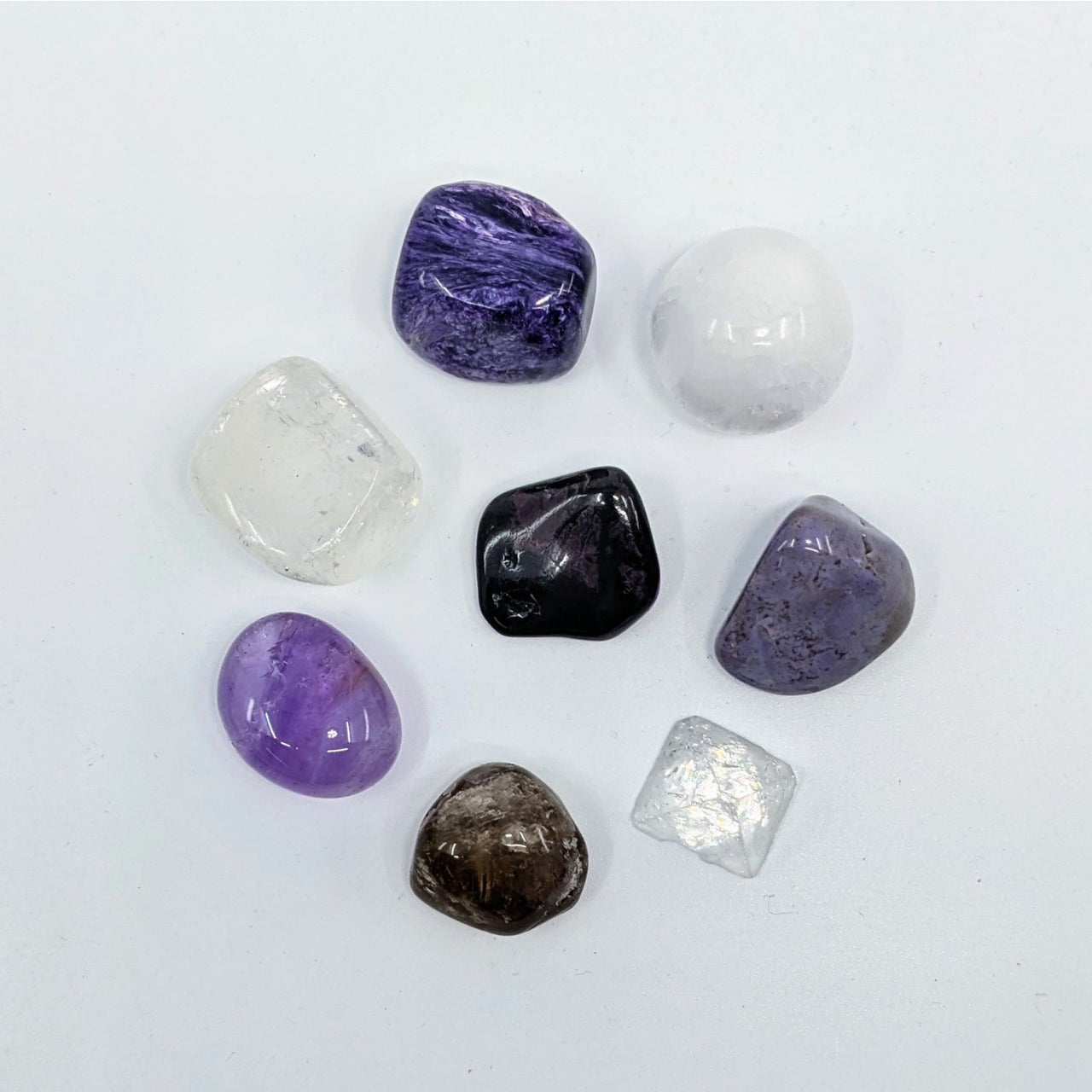 Polished gemstones from Crown Chakra Crystal Companion Set with 7 stones for energy balance