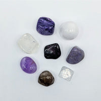 Polished gemstones from Crown Chakra Crystal Companion Set with 7 stones for energy balance