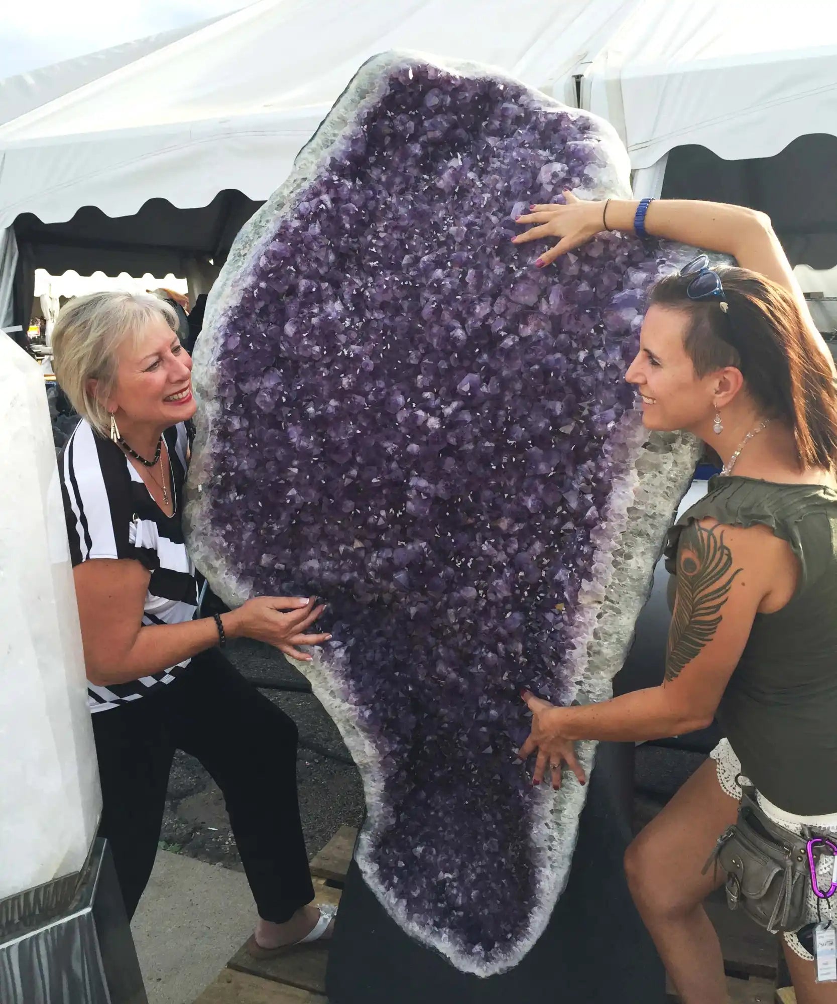 A deep purple amethyst geode with crystalline formations inside.