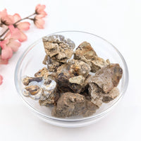 Deer Creek Fire Agate mixed size rough mineral specimens in glass bowl