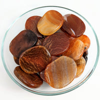 Bowl of colorful palm stones featuring Fire Agate 1.8’ Flat Palm Stone (24g) #SK9078