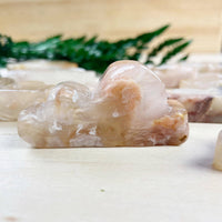Translucent peach Flower Agate Cloud Carving LV9390 with swirls