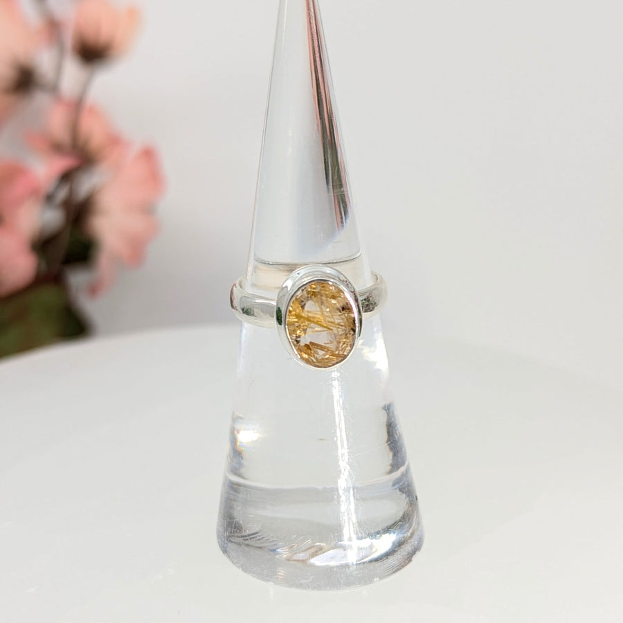 Silver ring with golden rutile gemstone featuring gold rutilated quartz for spiritual growth