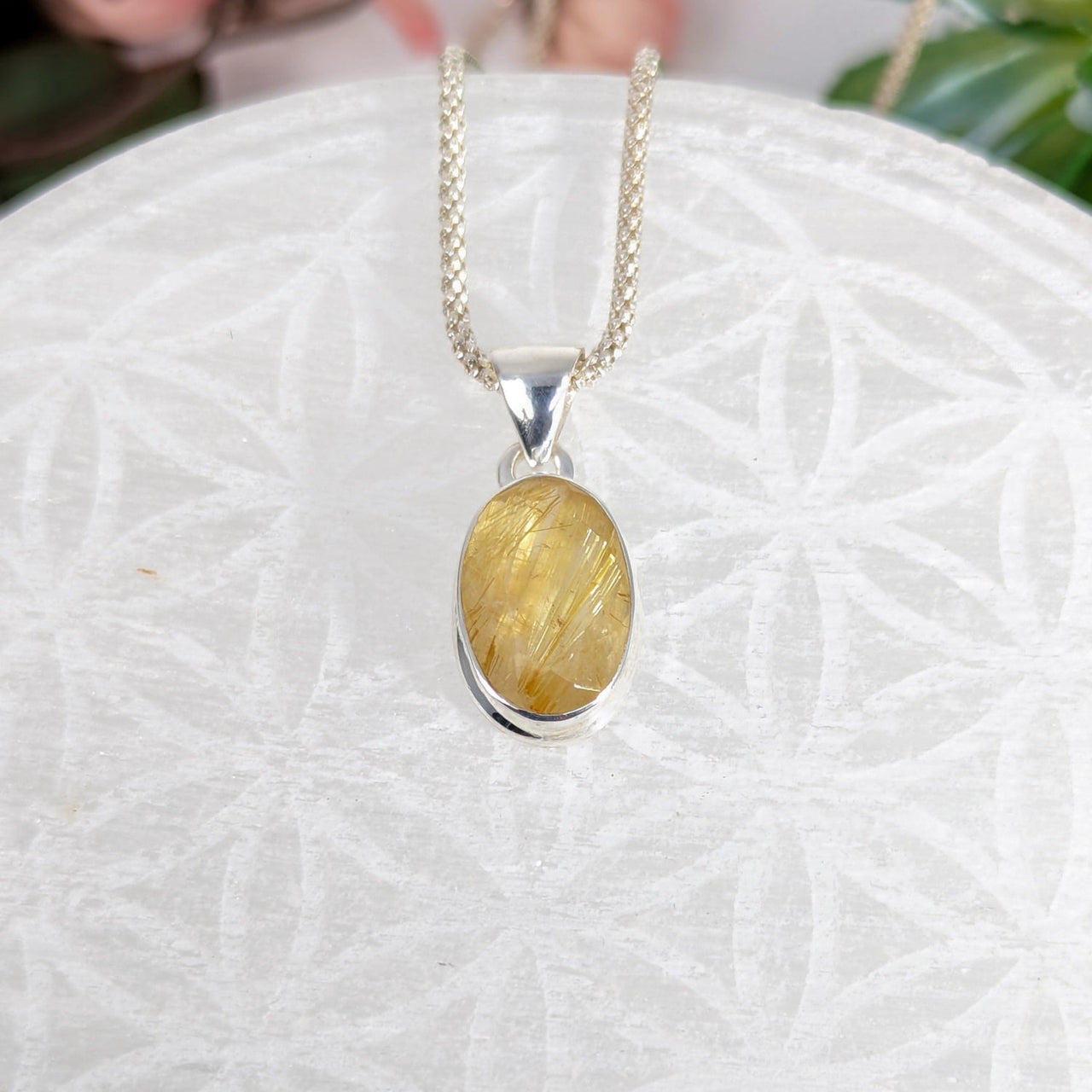 Golden Rutilated Quartz pendant necklace with oval faceted silver setting