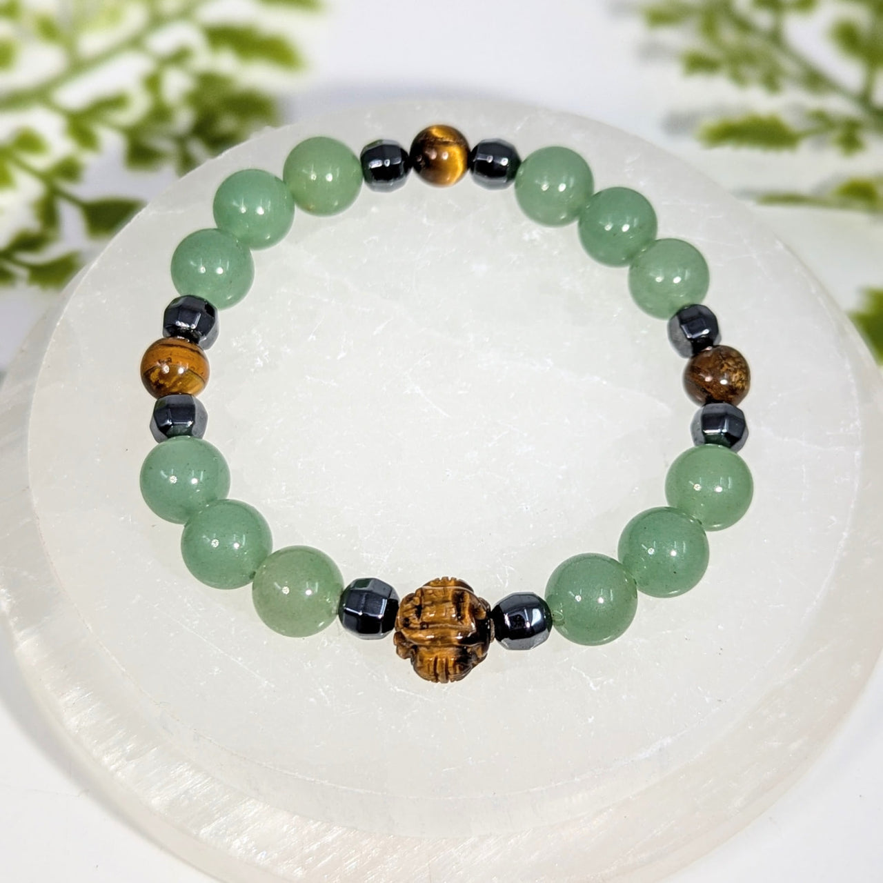 Good luck 8 inch multi stone bracelet with jade, tiger eye, black magnetic beads, and a carved wooden lion charm jewelry