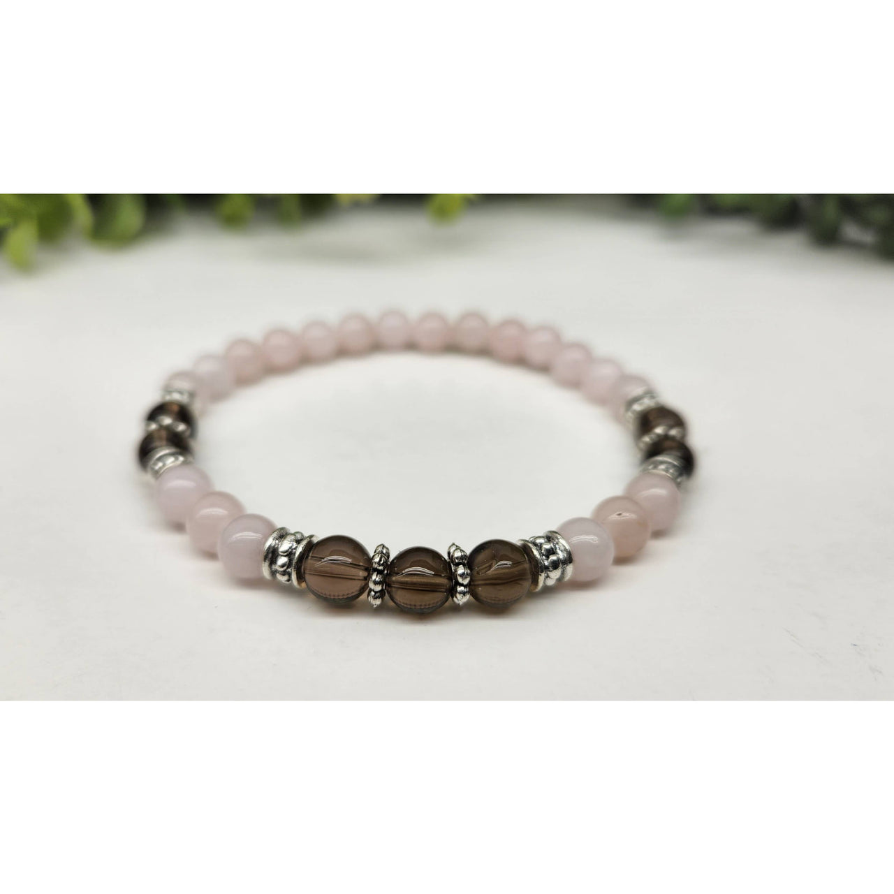 Rose quartz and smoky quartz beaded bracelet with silver accents, 7.5 inches