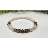 Rose quartz and smoky quartz beaded bracelet with silver accents, 7.5 inches
