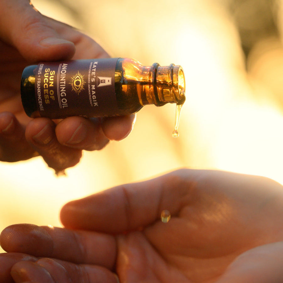 Kate’s Magik Sun of Success anointing oil in dark amber bottle with purple label