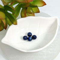 White ceramic leaf-shaped dish with Lapis Dark Blue 8mm round beads