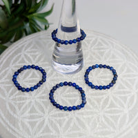Blue beaded rings featuring Lapis Lazuli stretch ring with architectural inlays style