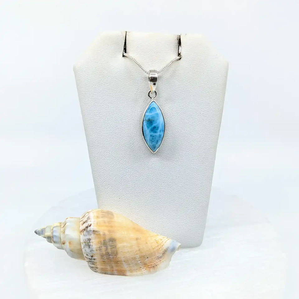 Marquise-shaped pendant with blue Larimar stone in sterling silver setting.